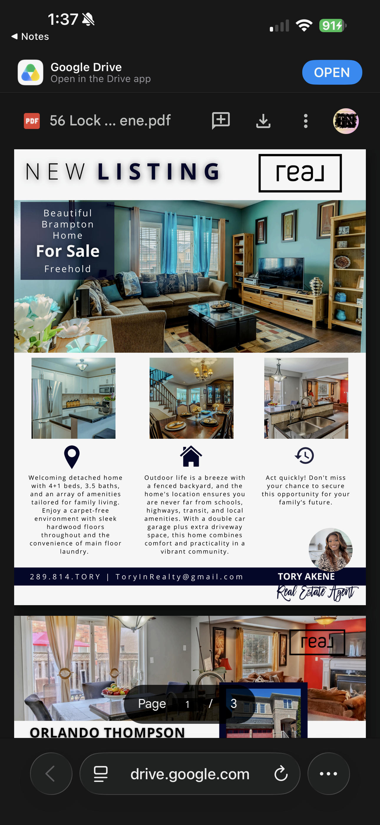 Spacious living room with blue walls and hardwood floors