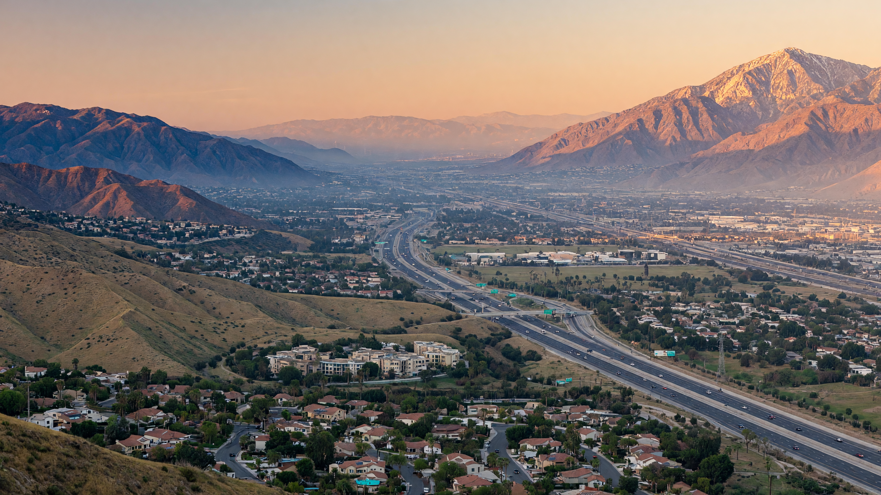 Sweeping view of the Inland Empire valley with mountains in the distance