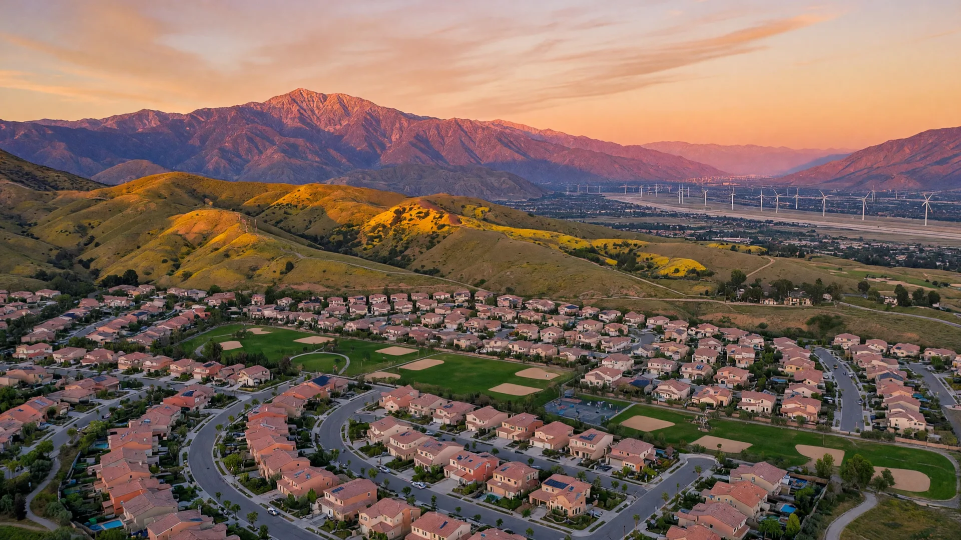 Aerial view of master-planned homes in Beaumont, California with the San Bernardino Mountains in the background