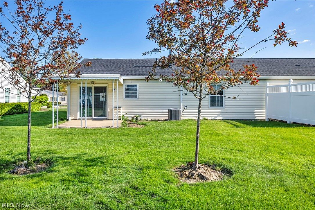 Backyard patio with covered porch and privacy fence
