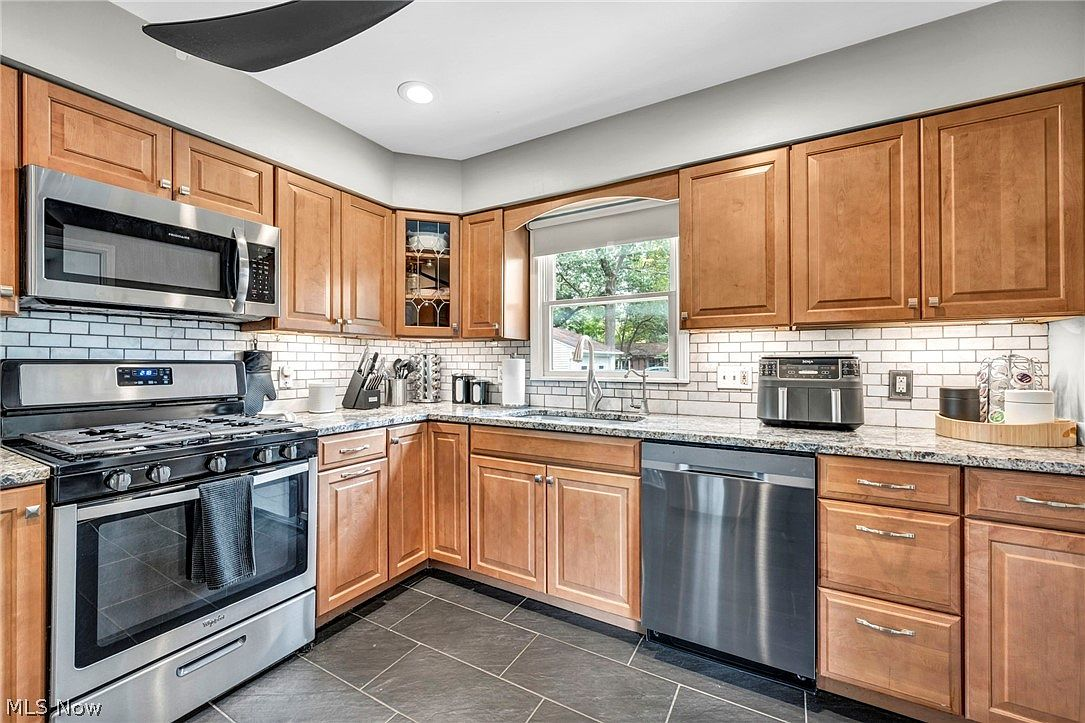 Kitchen with wood cabinets and ceramic tile