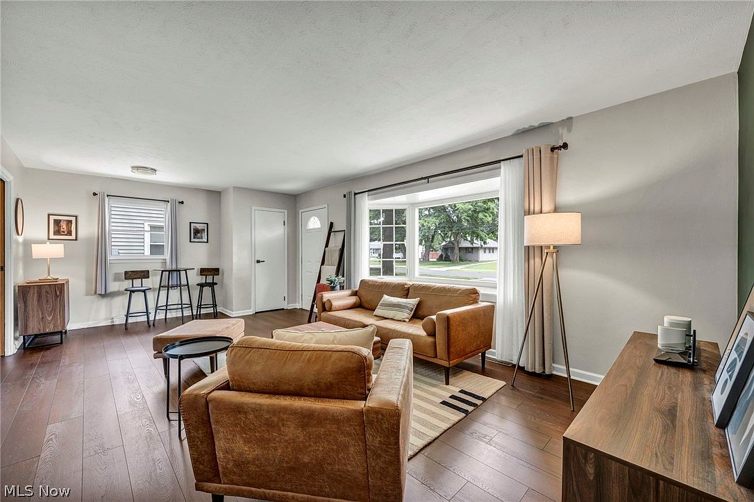 Spacious living room with updated flooring