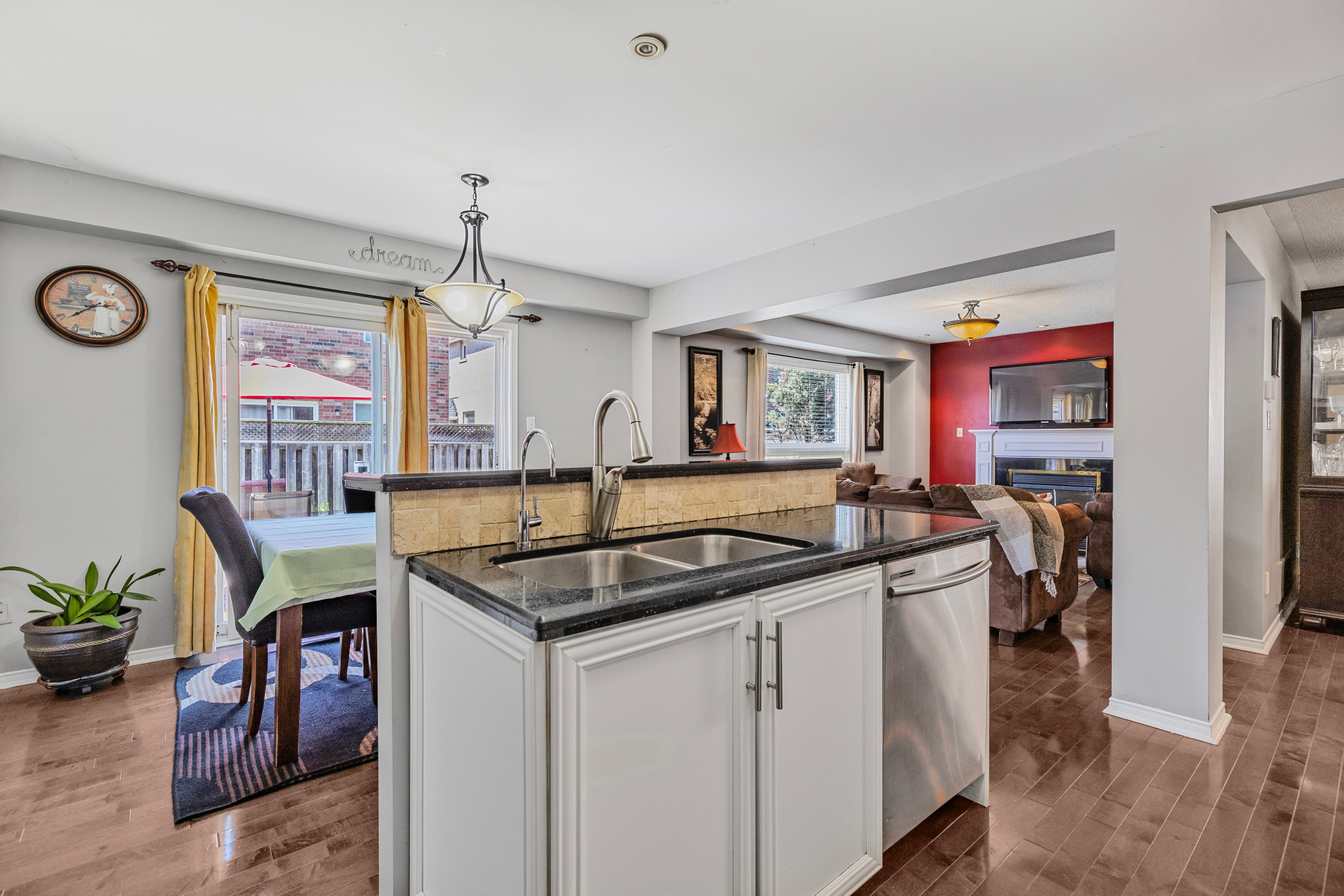 Kitchen peninsula with sink and view to living area