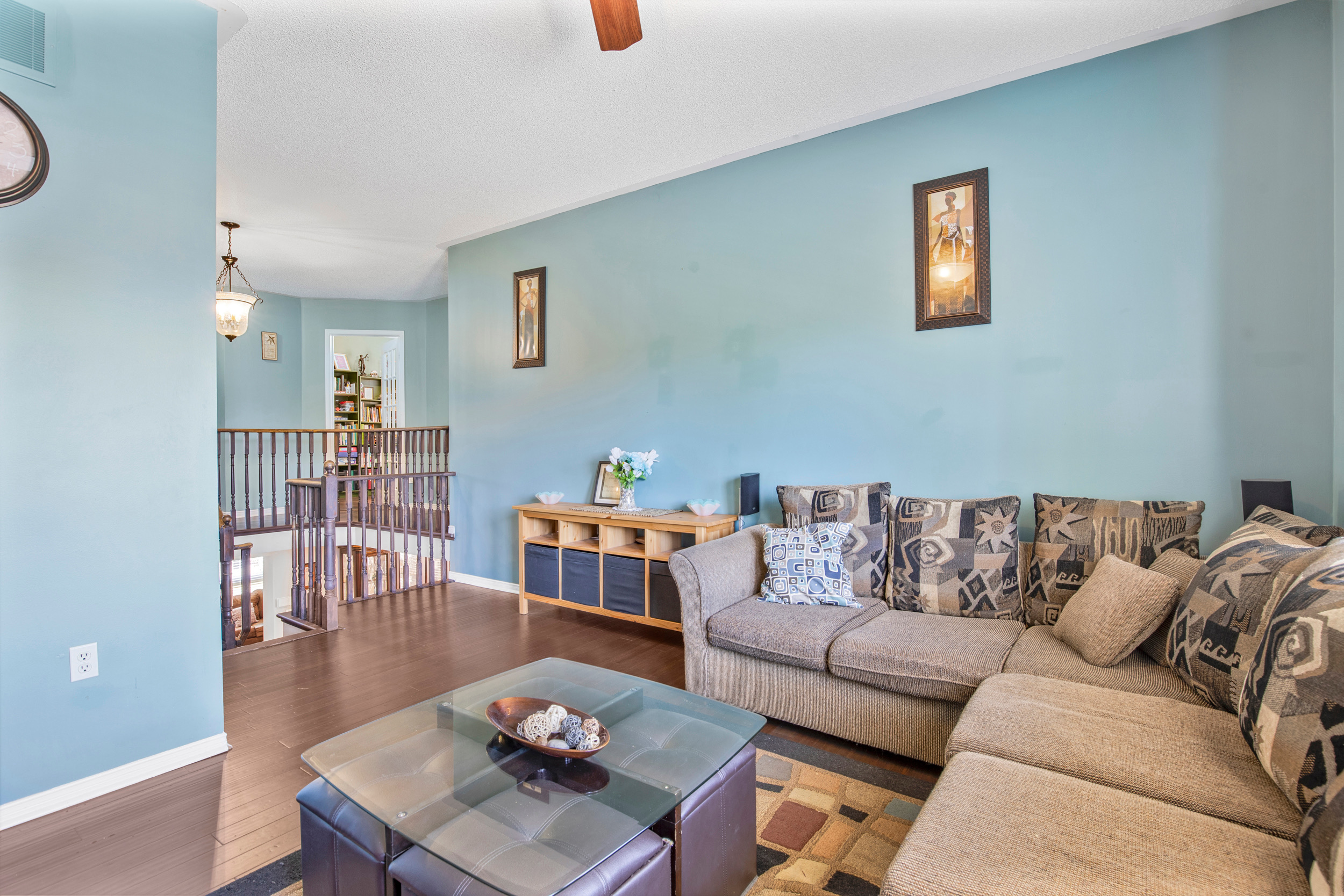 Living area looking toward staircase with blue walls