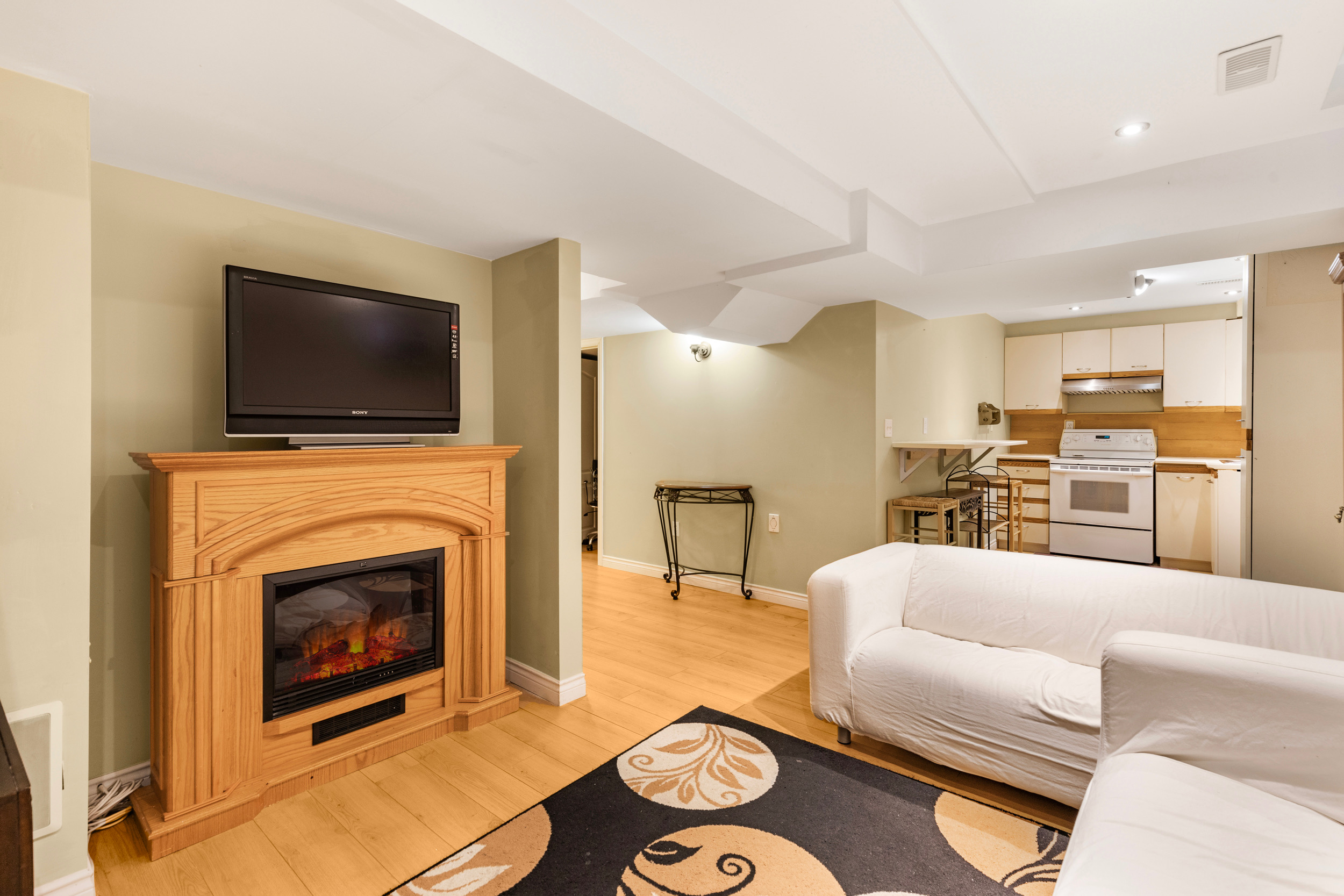 Basement living area with integrated kitchenette