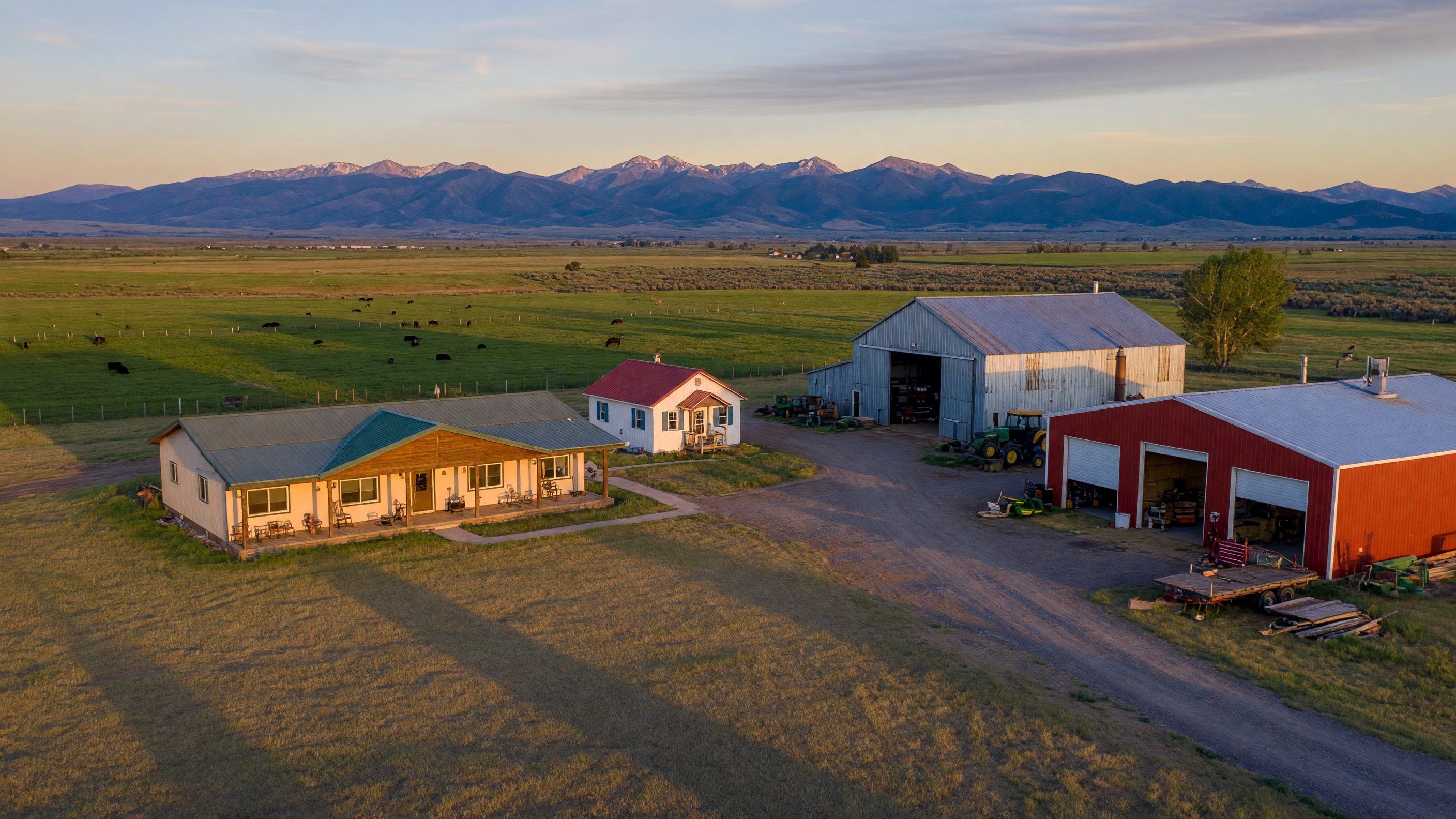 Multi-structure rural property at golden hour in the Treasure Valley