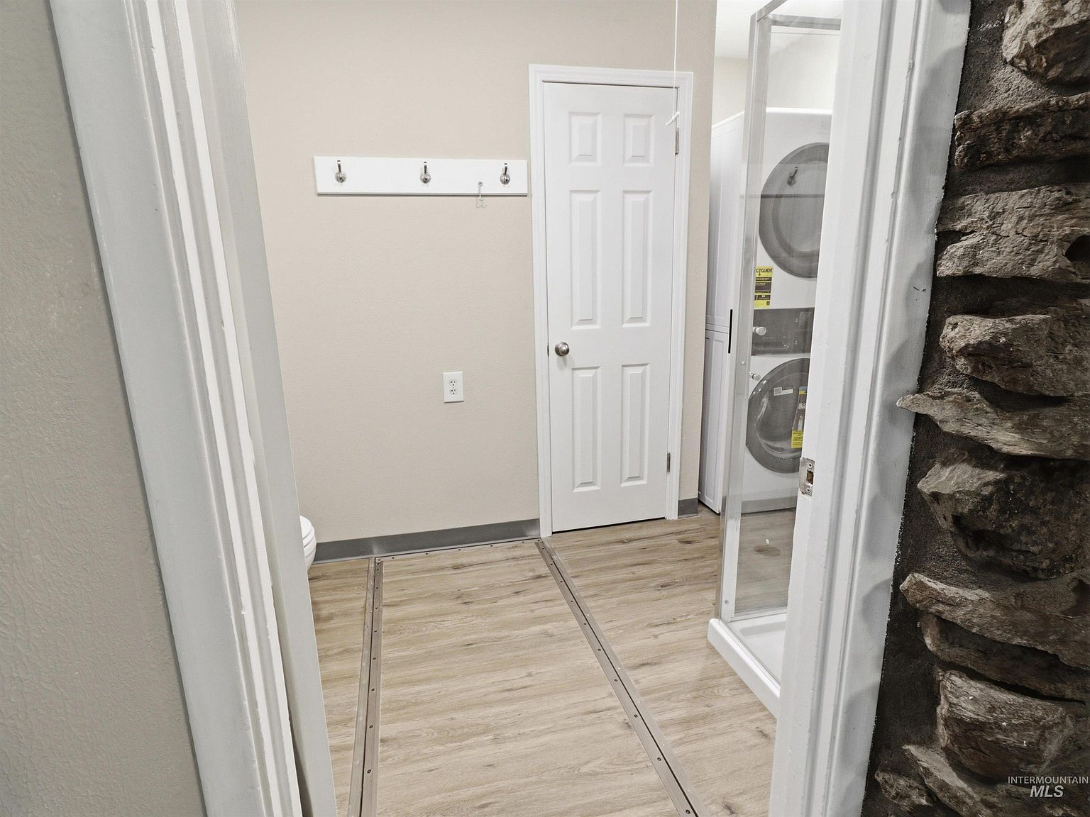 Laundry and utility room with stacked washer/dryer