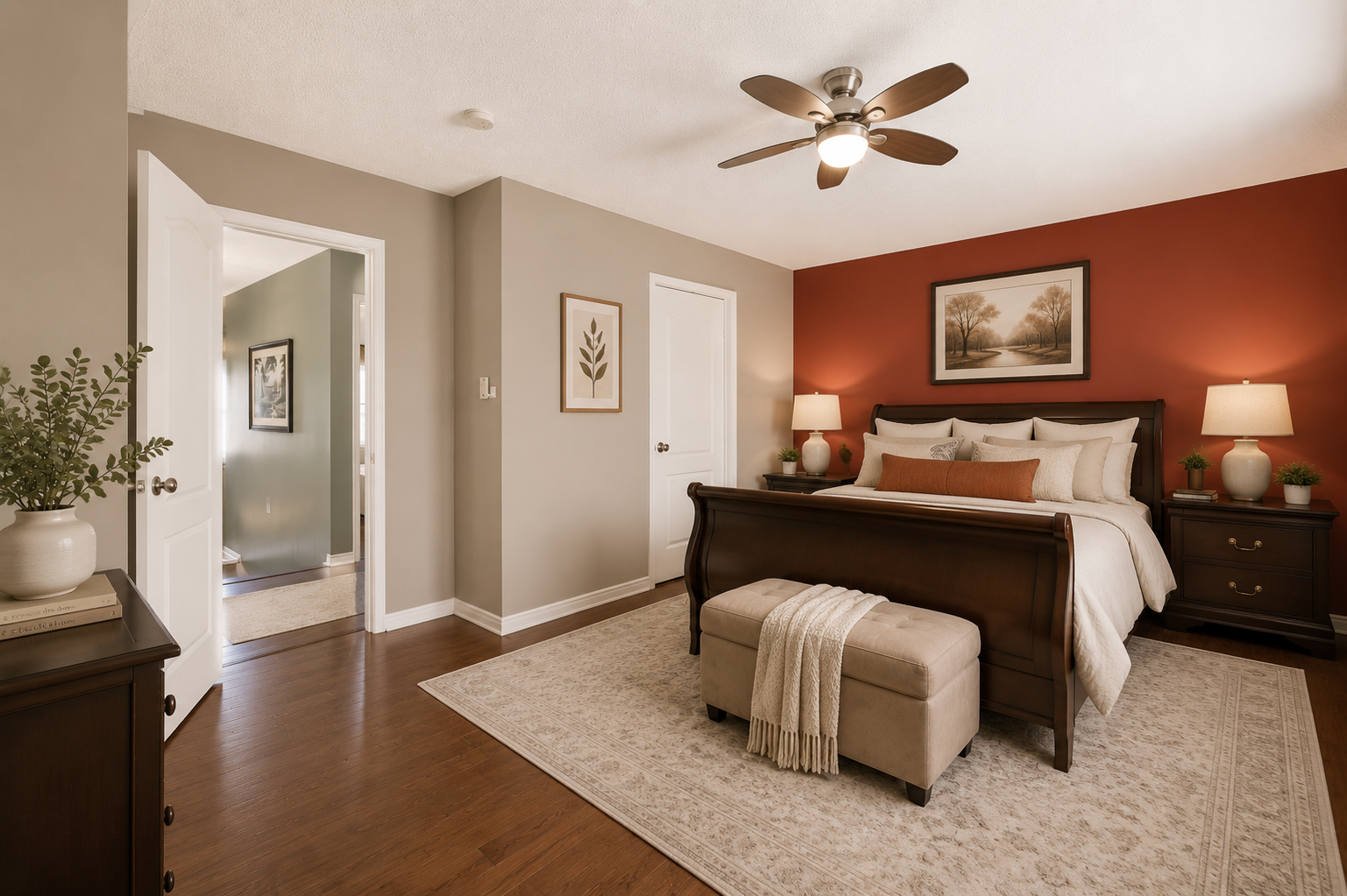 Virtually staged primary bedroom with red accent wall and contemporary furniture