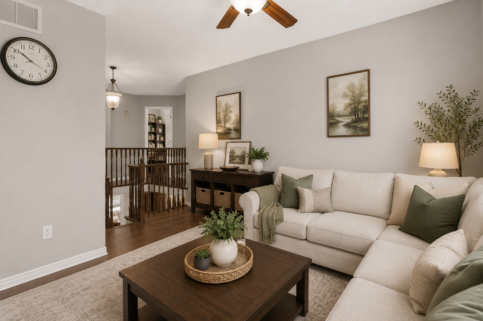 Virtually staged living room seating area with modern furniture and warm lighting