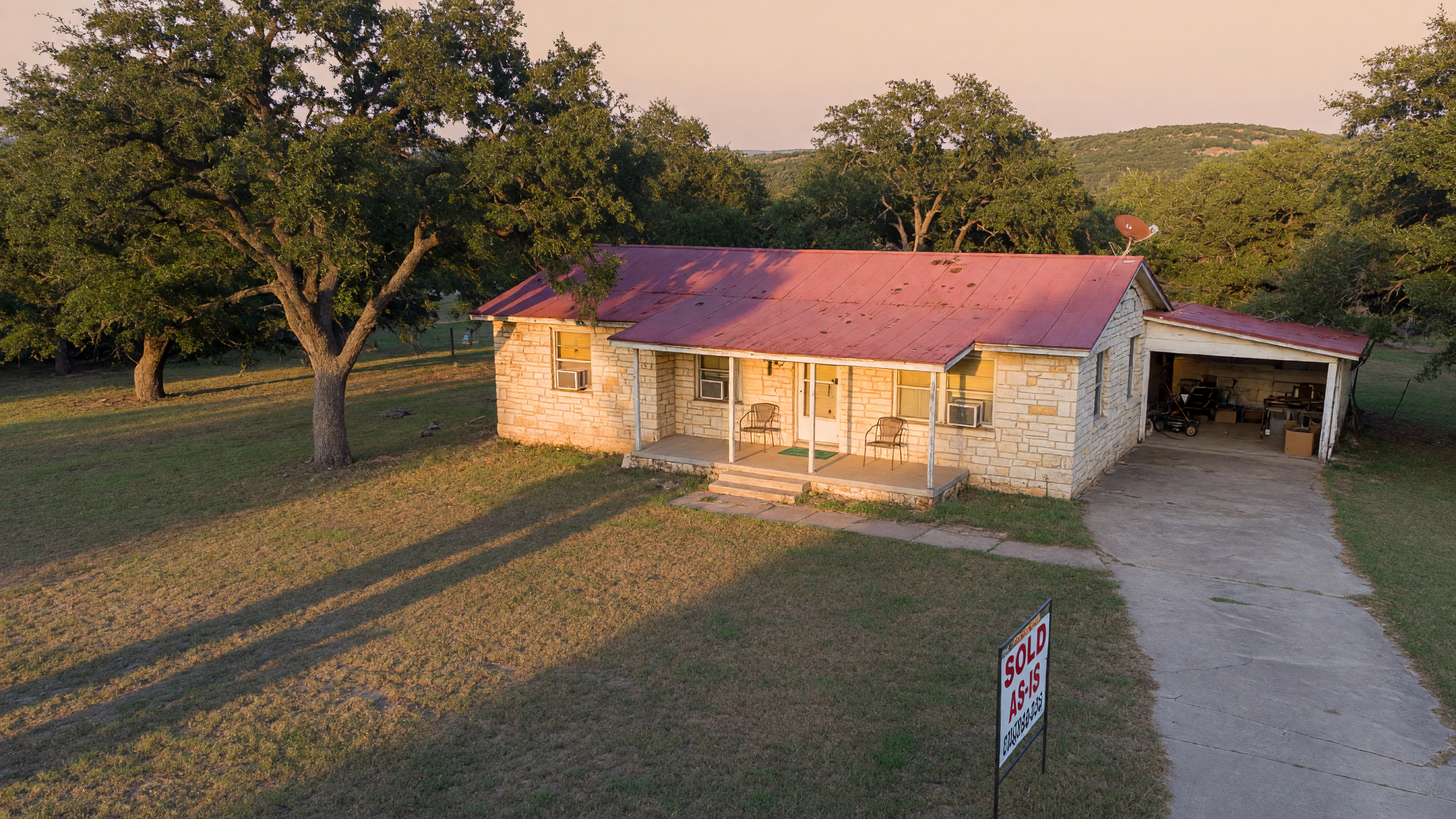 A Texas Hill Country home showing signs of age, representing an estate property that could be sold as-is during probate