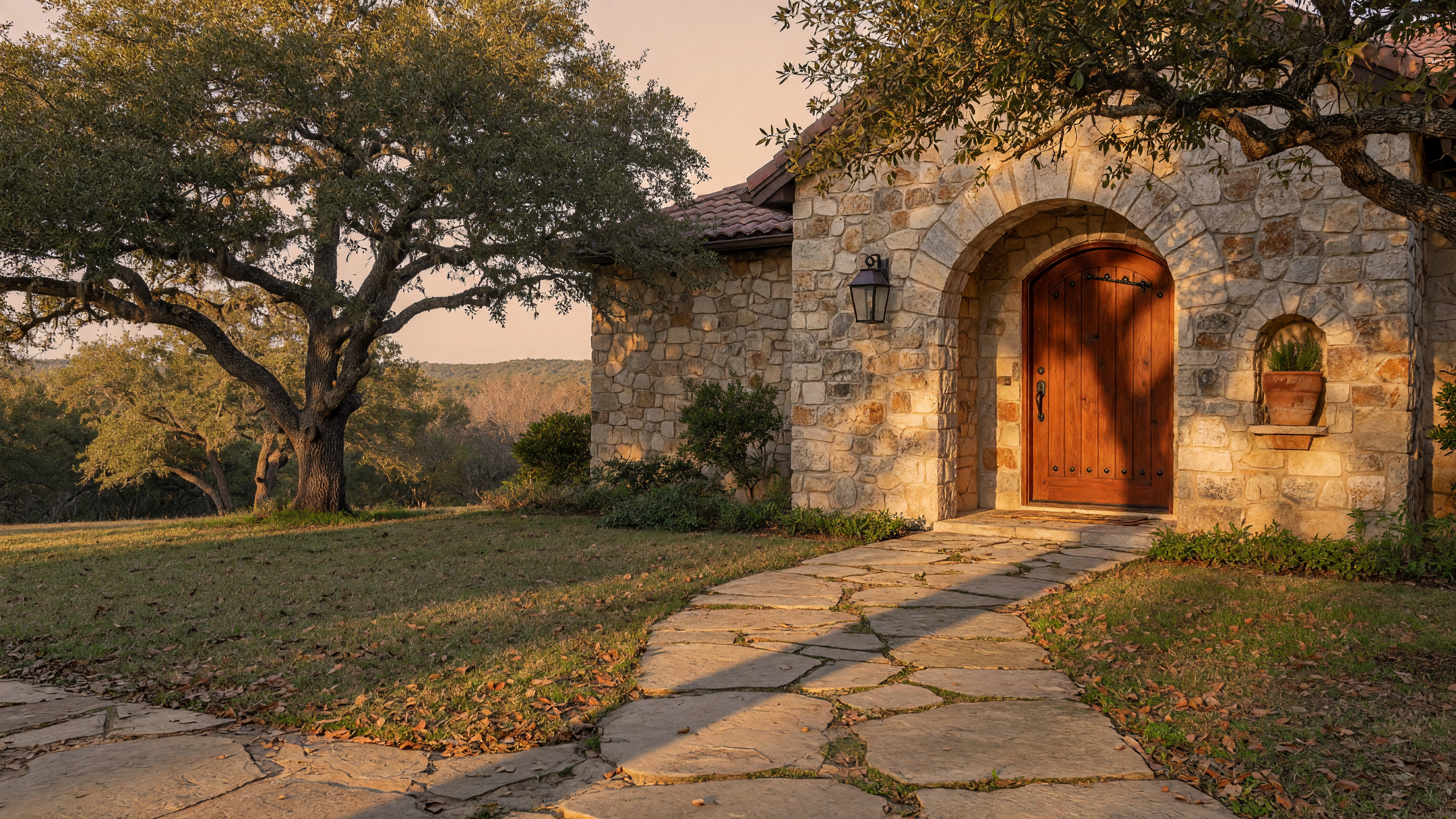 Texas Hill Country home entrance with stone archway and wooden front door
