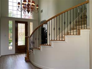 Grand foyer with sweeping staircase and elegant details at 6106 Peachtree Hill Court