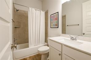 Neutral guest bathroom at 16903 Lupine Meadow Lane in The Groves, Humble, Texas