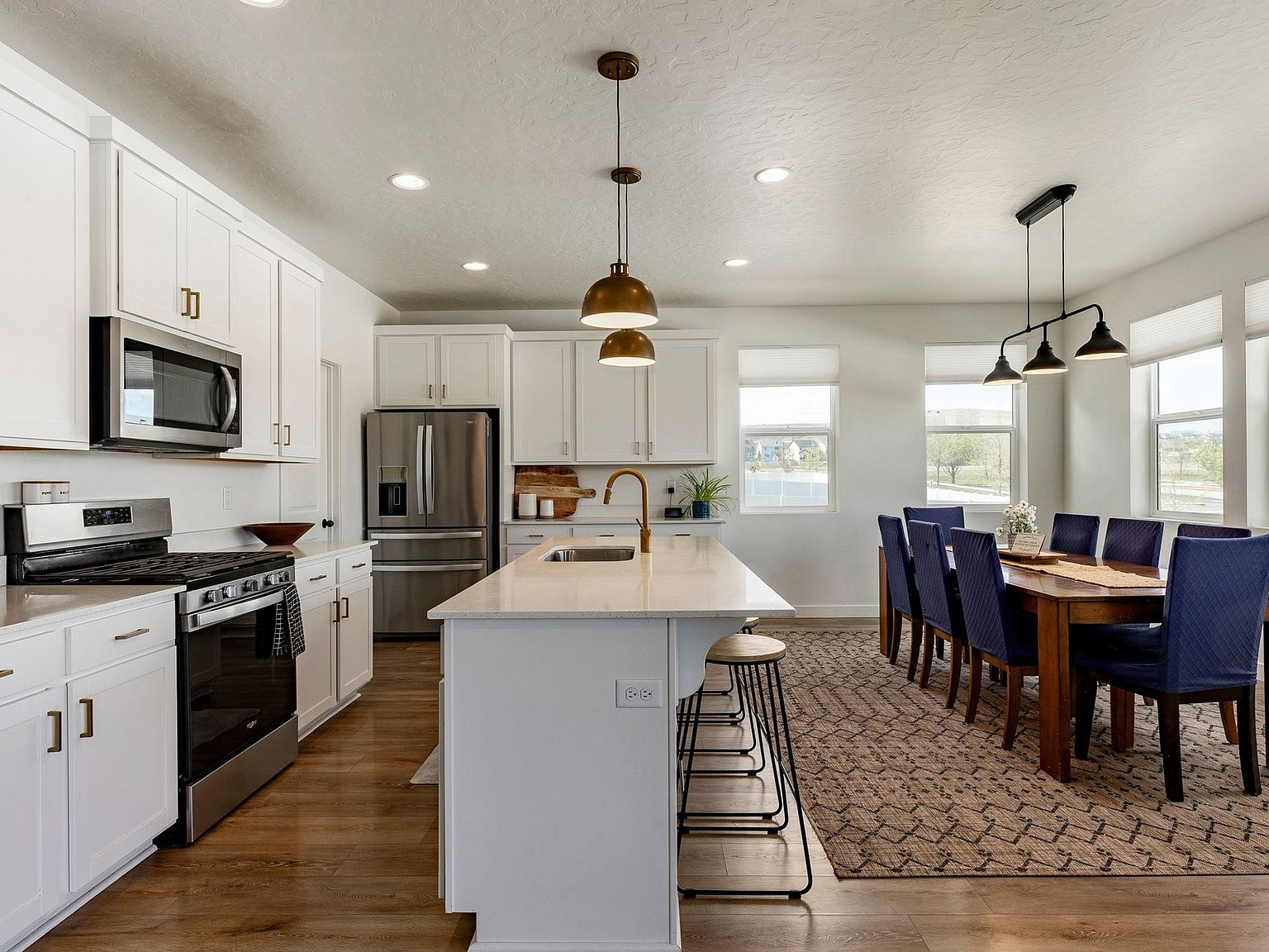 The kitchen and dining area flowing together as one bright space