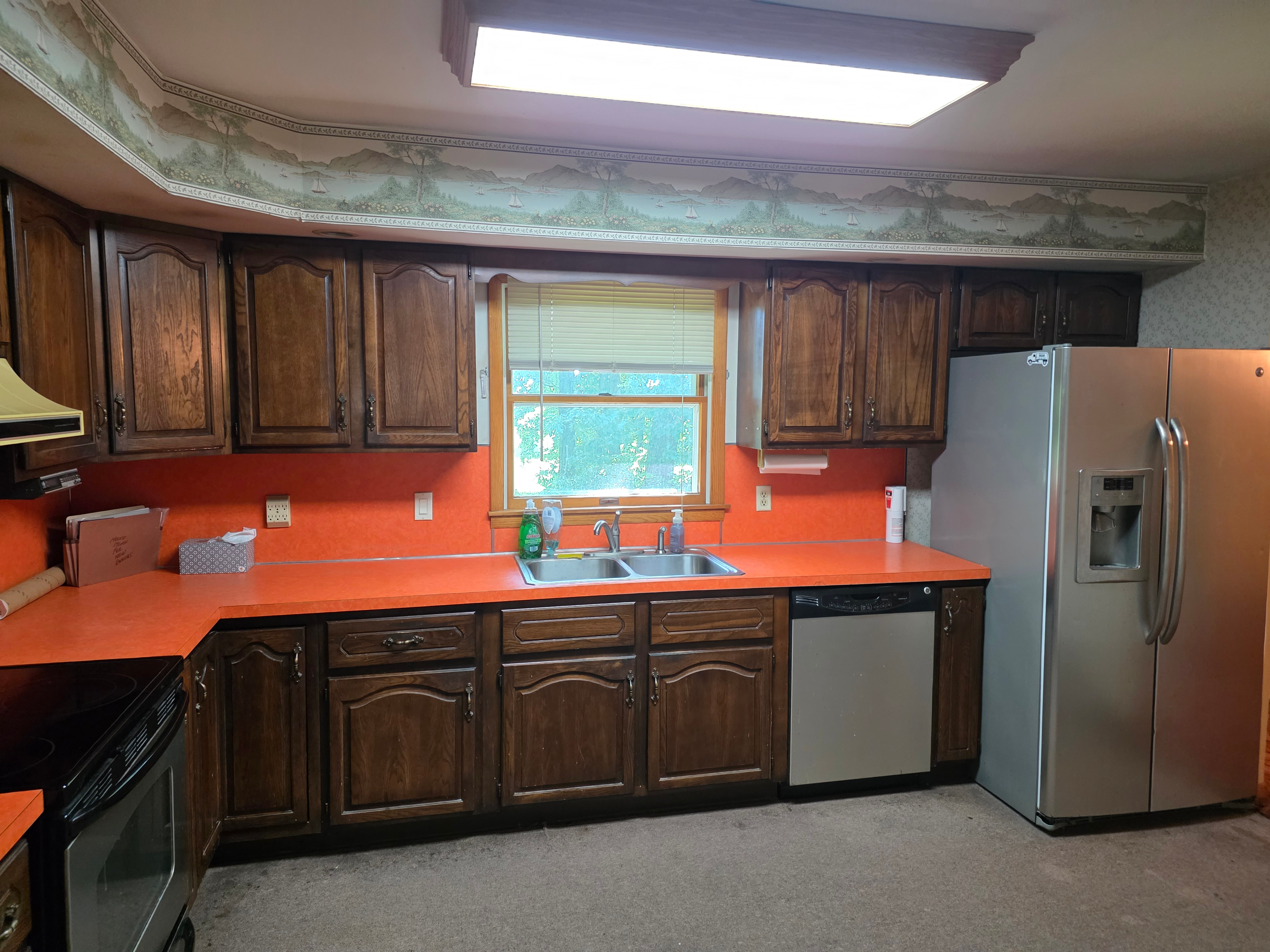 Eat-in kitchen with oak cabinetry