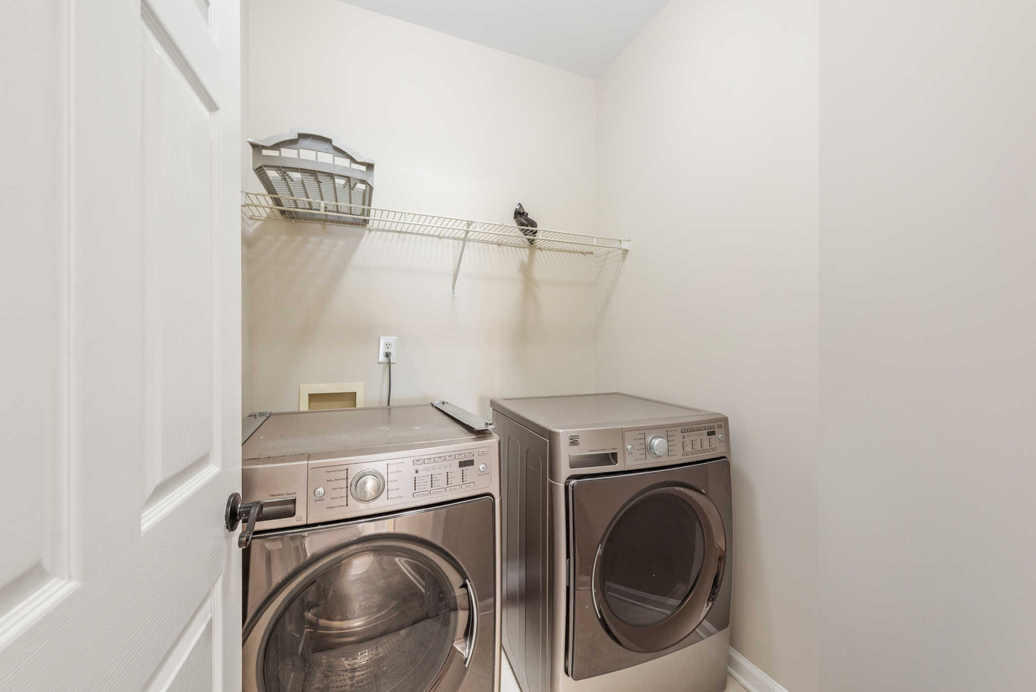 Laundry utility closet with front-load washer and dryer