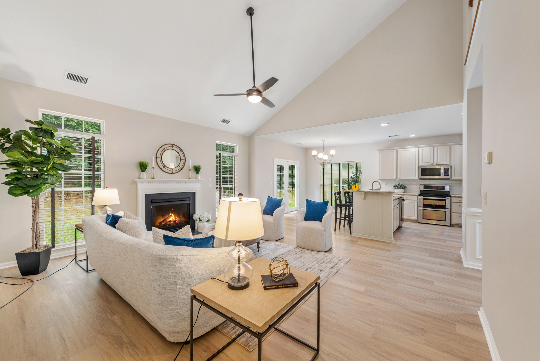 Vaulted open-concept living area flowing into the kitchen