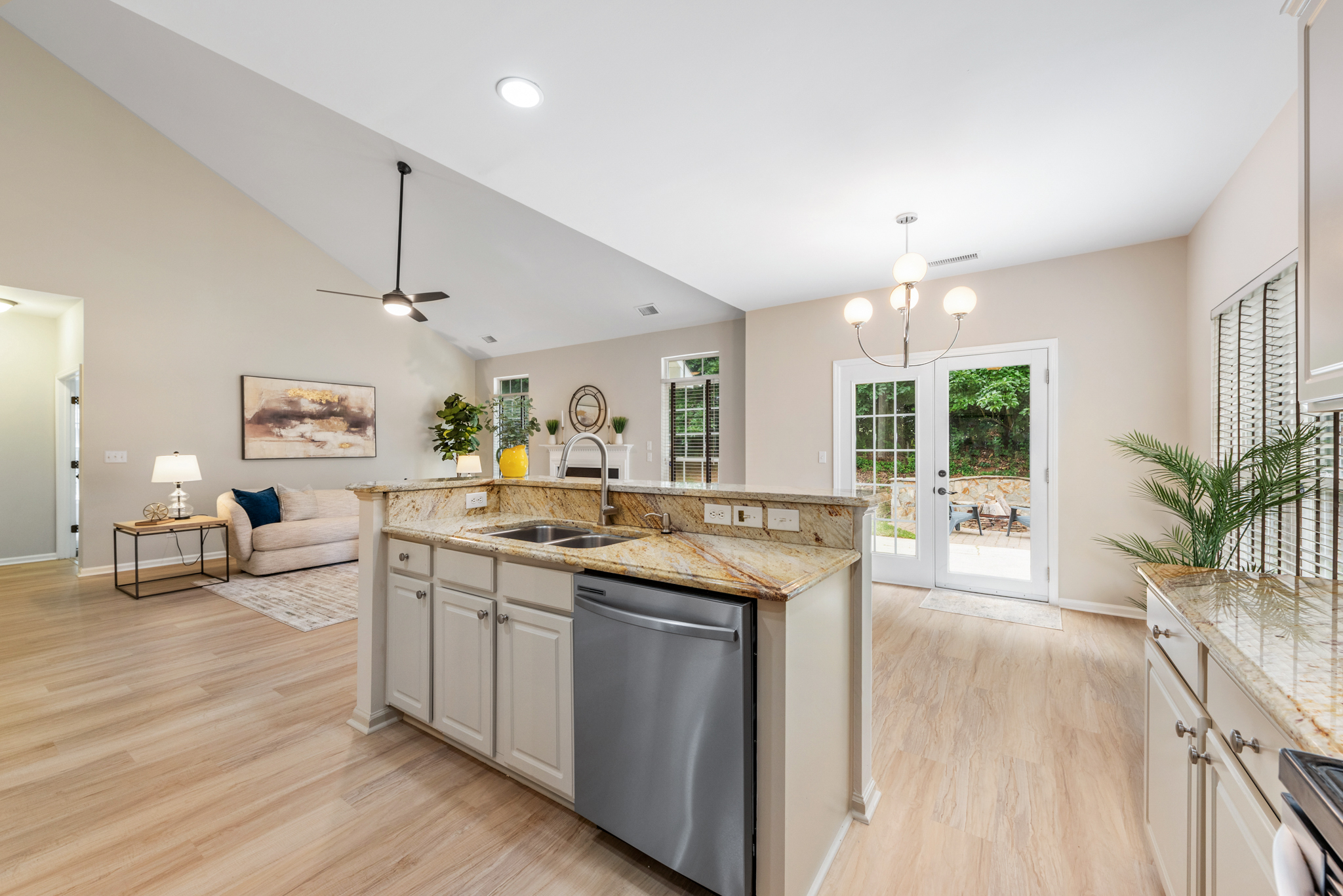 Wide-angle view from kitchen into the vaulted living room