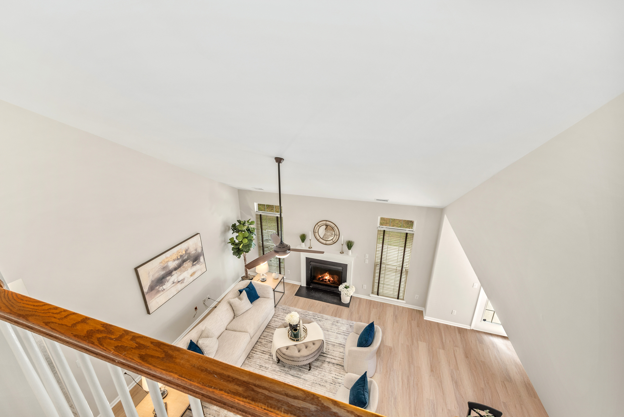 High-angle view looking down into the family room from the upper level