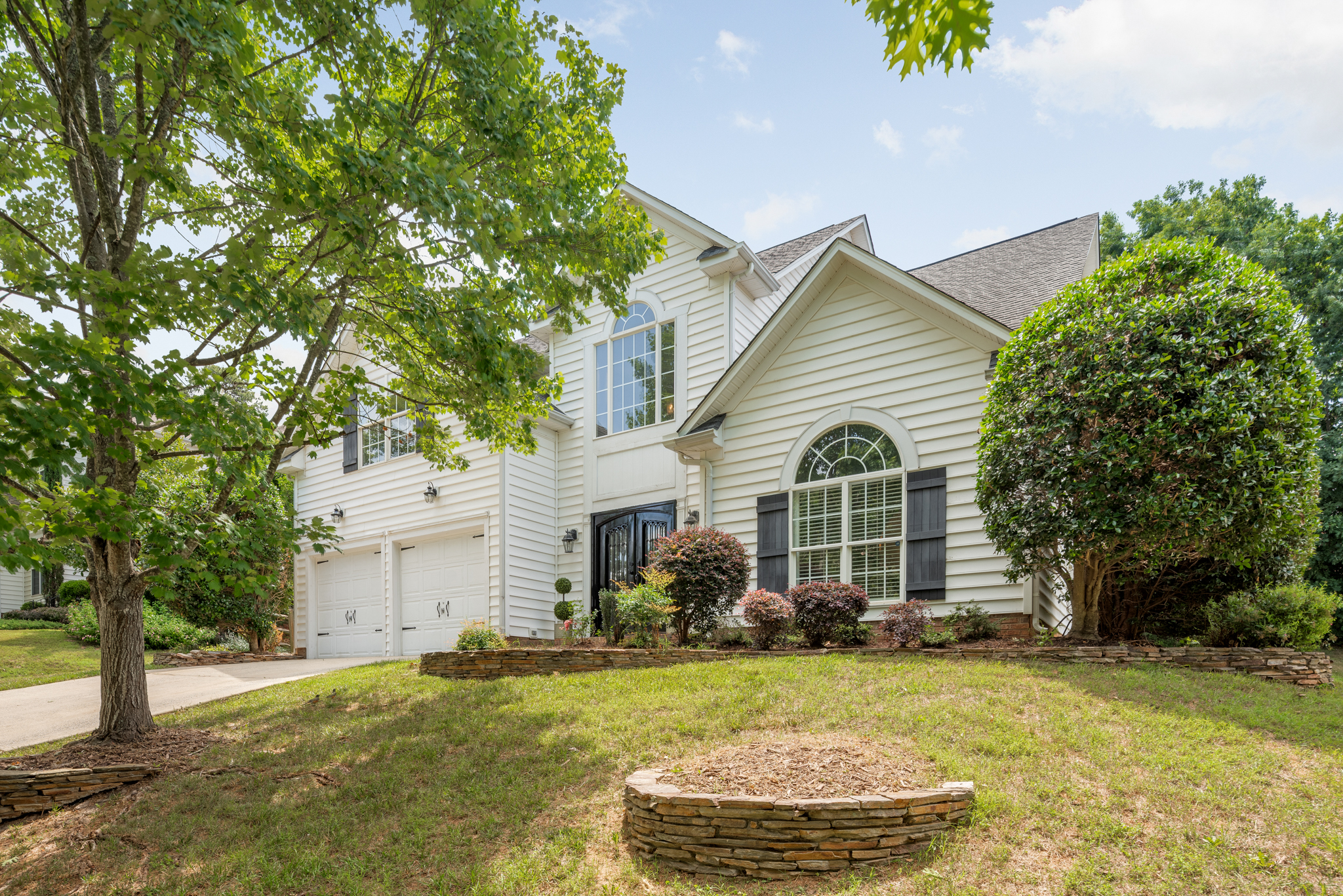 Front exterior of 20307 Southshore Dr, Cornelius, NC — a two-story transitional home with white siding and dark shutters