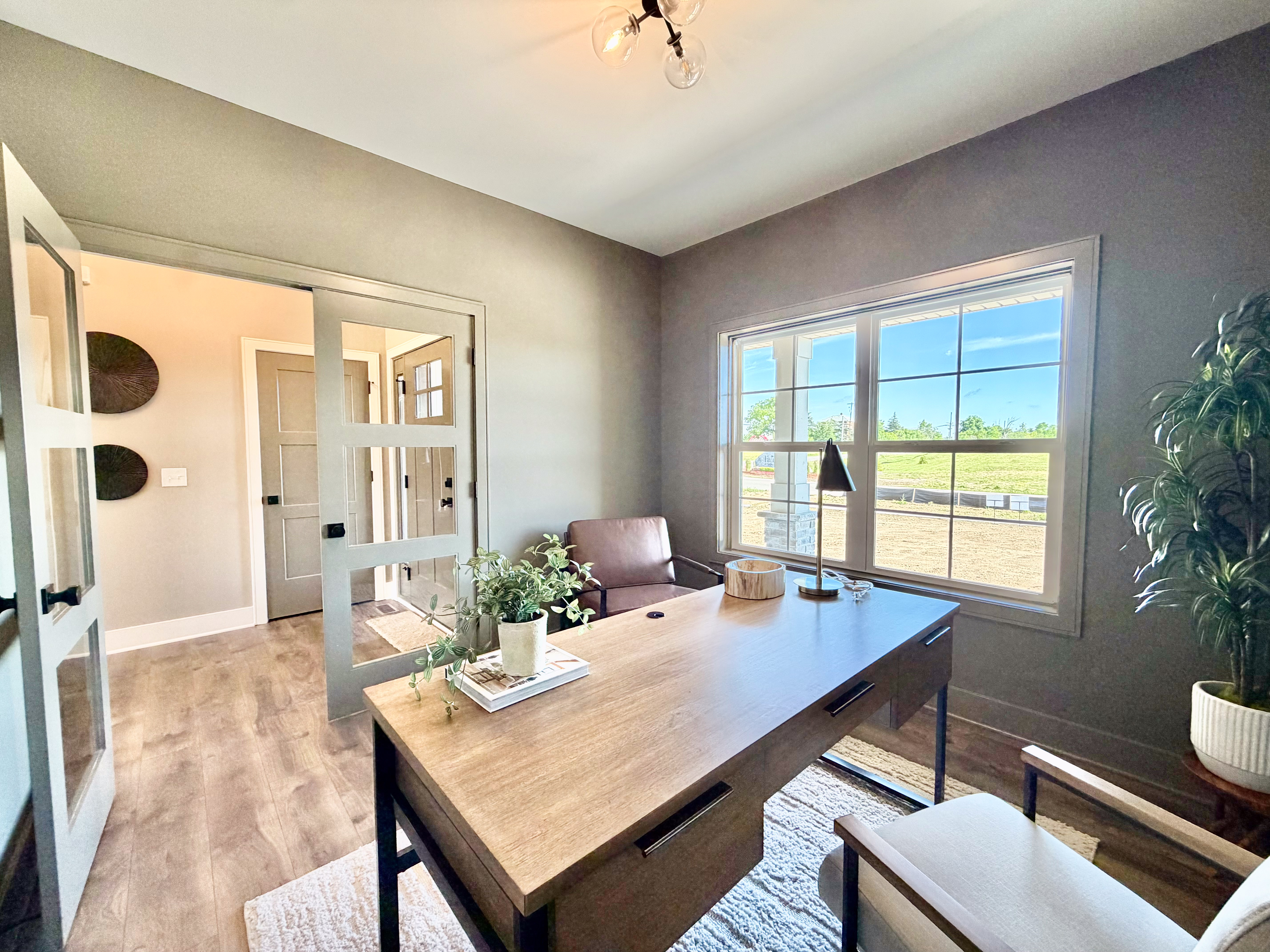 Office with French doors and grey accent walls