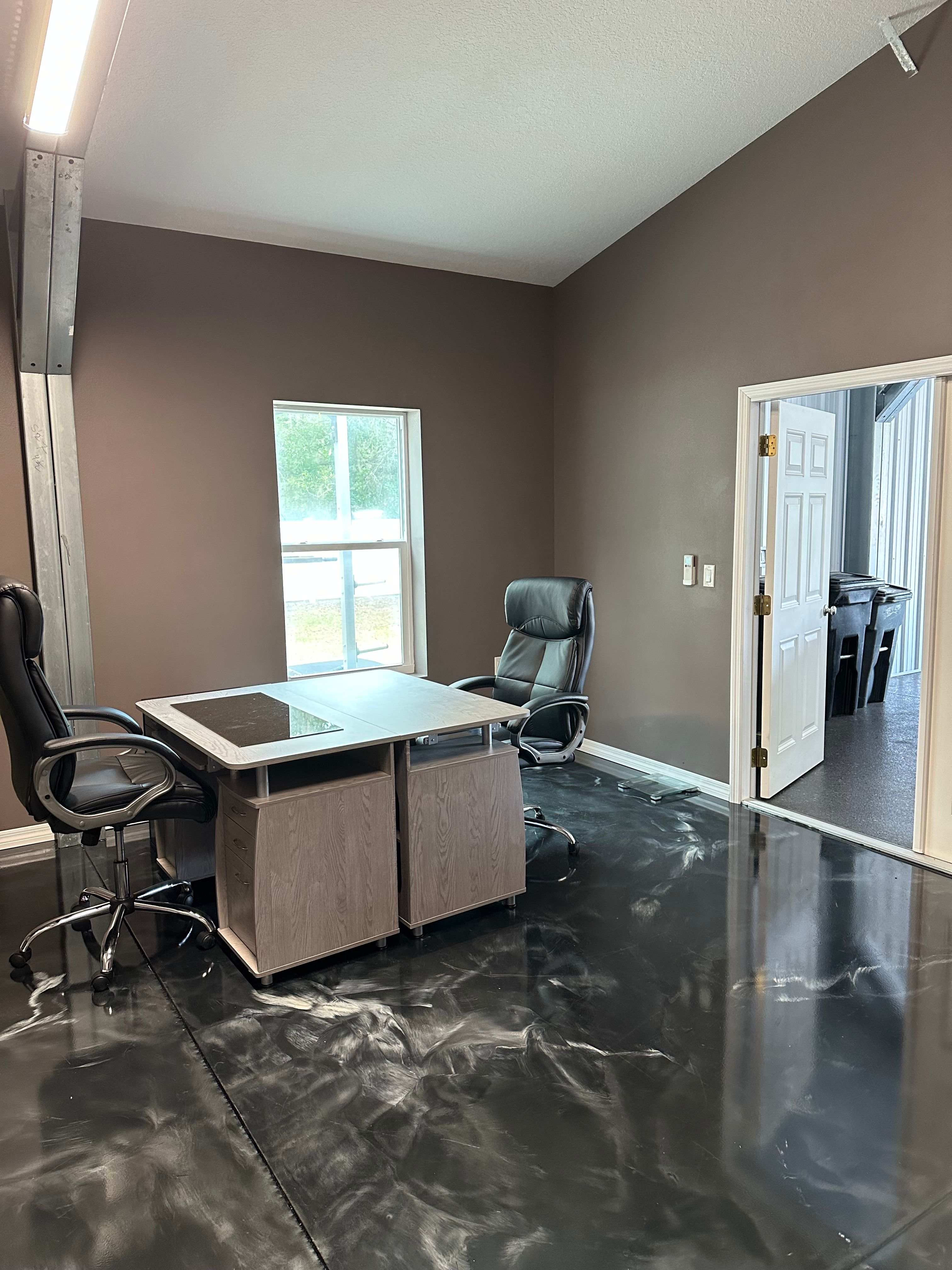 Executive office space with full bath nearby, ready for day-to-day operations