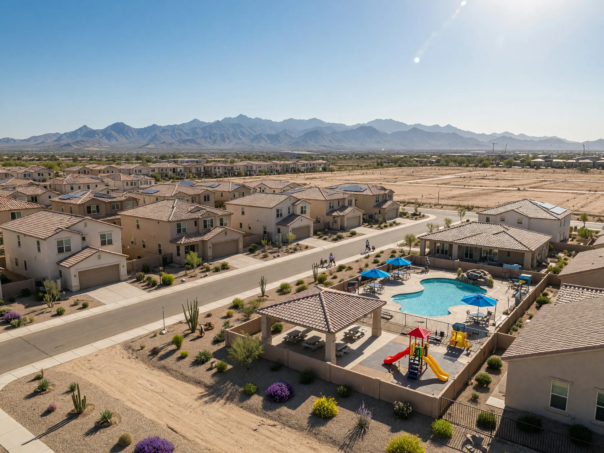 New construction in Surprise with stucco homes, community amenities, White Tank Mountain views, and desert landscaping in a mixed retirement and family community