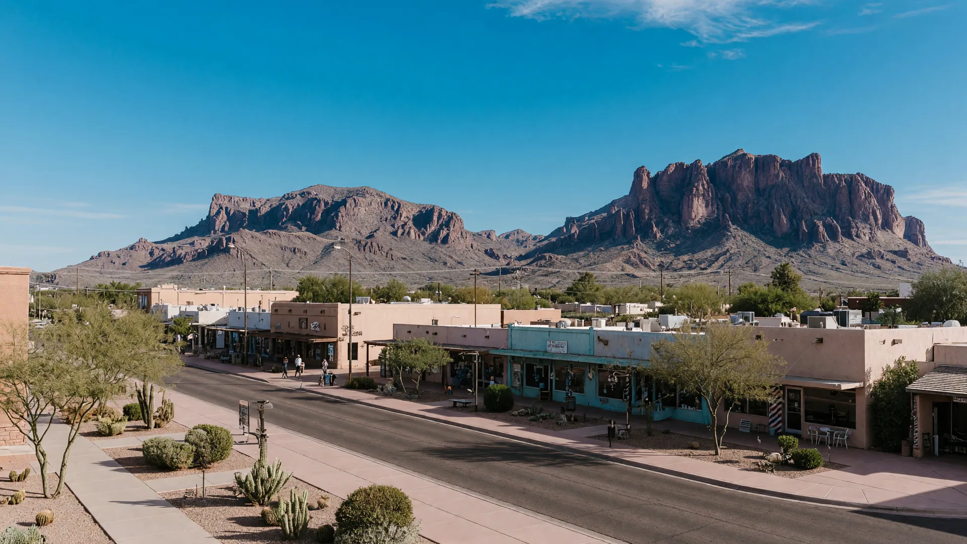 Scottsdale Old Town district with Western-themed storefronts, art galleries, upscale desert town feel, and mountain backdrop along Scottsdale Road