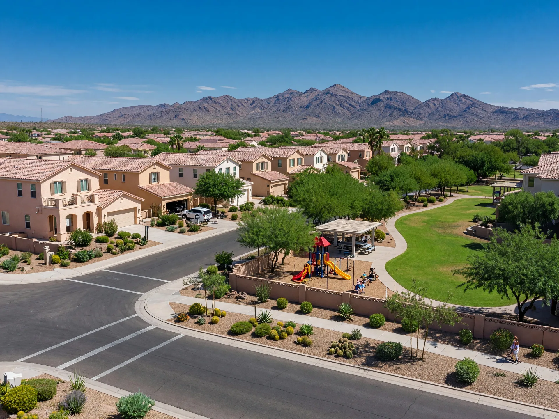 Family-friendly master-planned community in Gilbert with stucco tile-roof homes, parks, wide streets, and San Tan Mountain views
