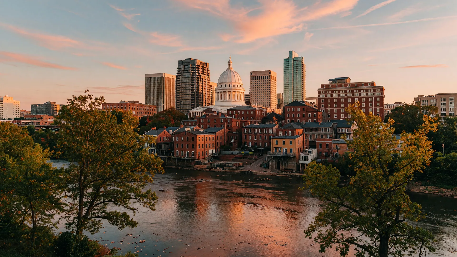 Richmond Virginia downtown skyline across the James River with the State Capitol dome and Shockoe Slip district at golden hour