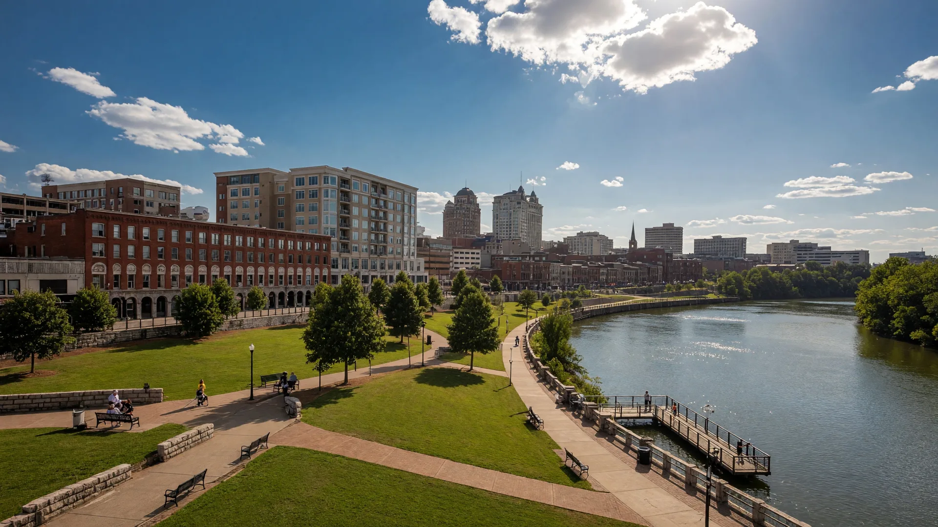 Clarksville Tennessee's downtown riverfront along the Cumberland River with Liberty Park, green spaces, and the city skyline