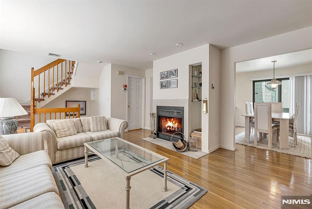 Open-concept living and dining room with fireplace
