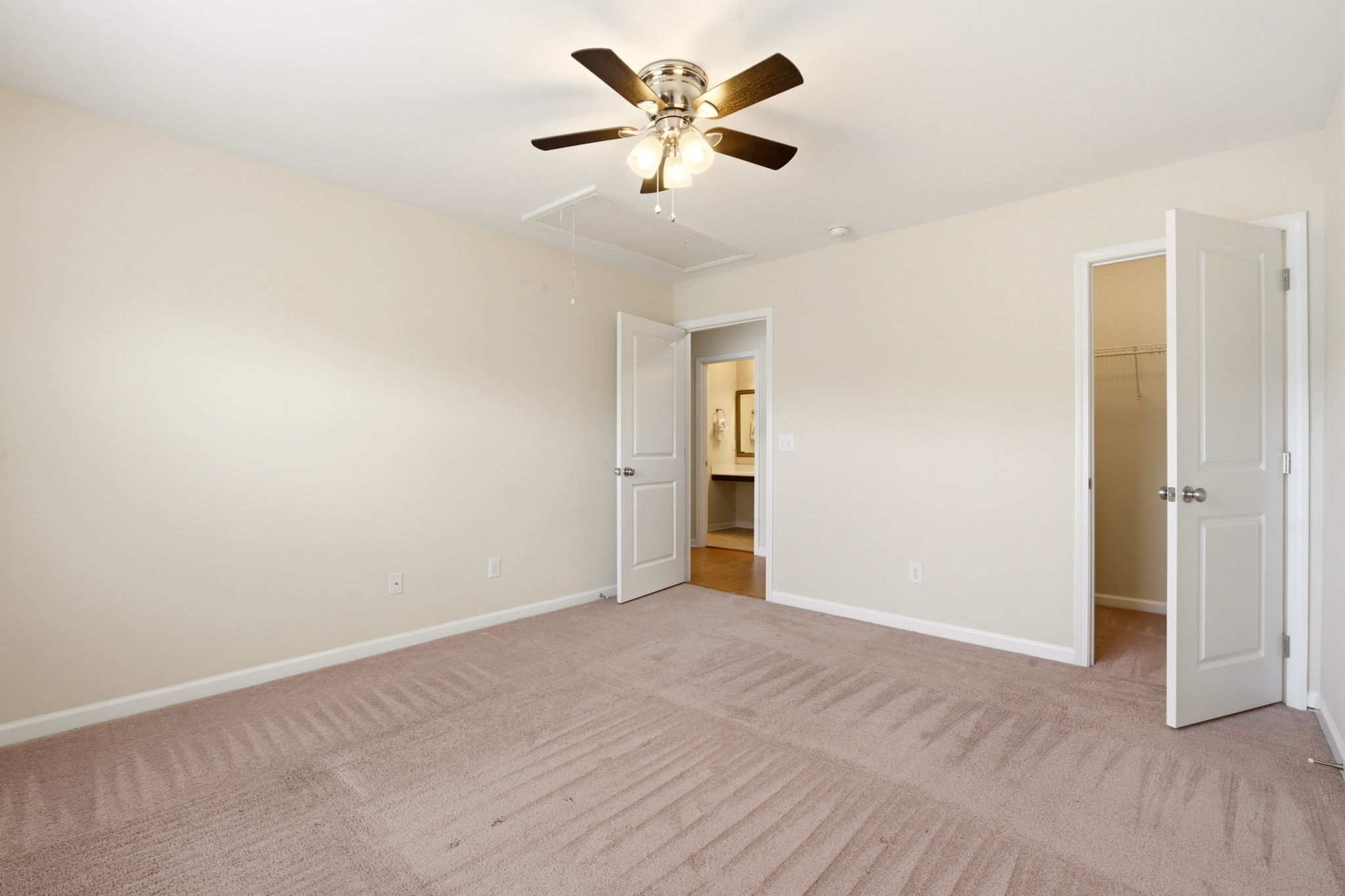 Master bedroom on the main floor with vaulted ceiling