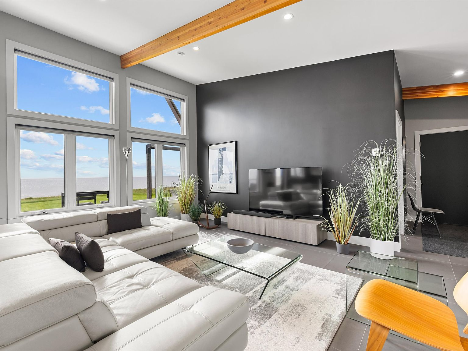 Living room with floor-to-ceiling ocean-facing windows