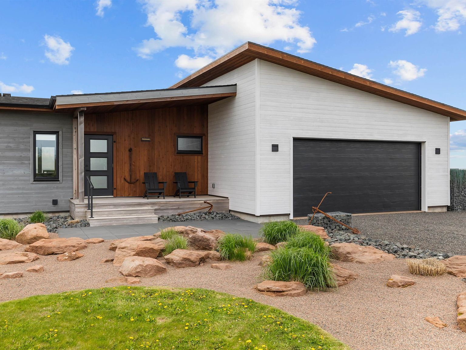 Front entry with stained cedar siding and white accents