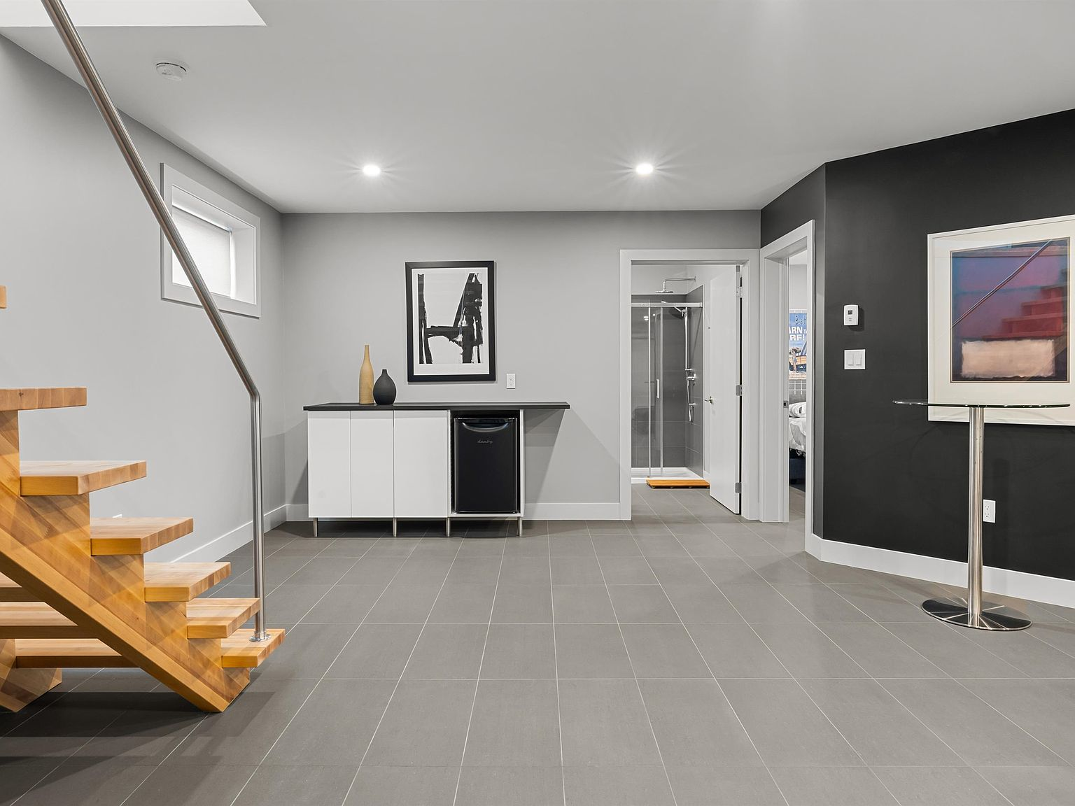 Lower level family room with floating staircase