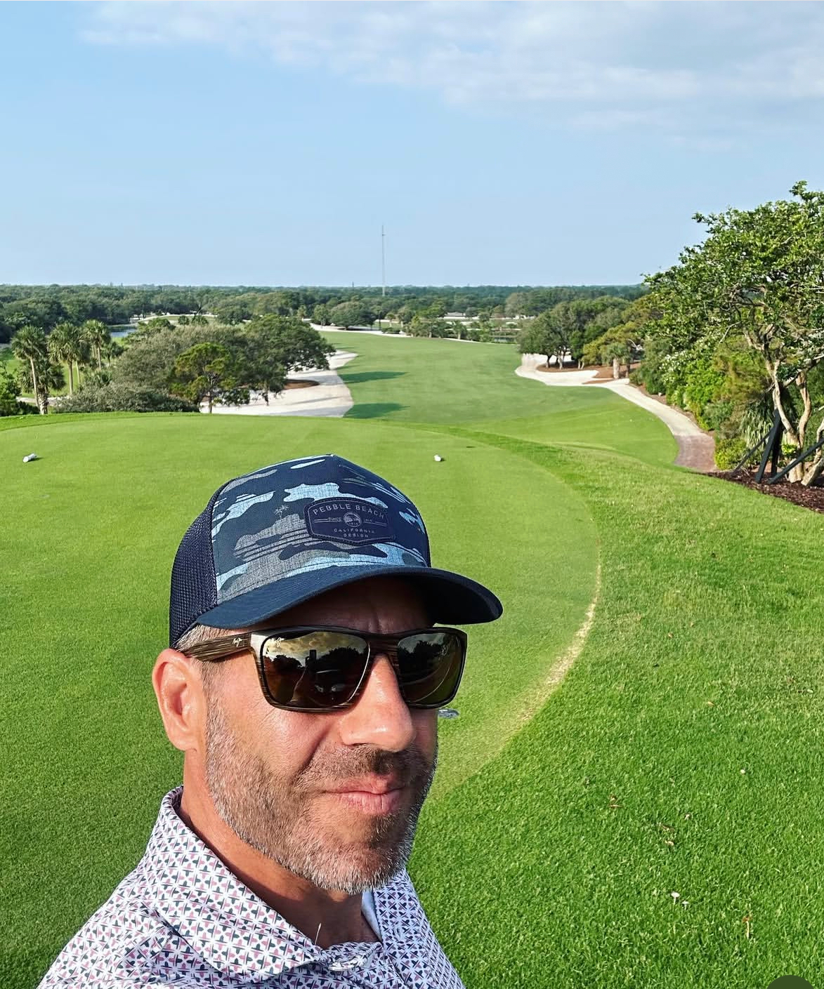Alex Haigh at Sailfish Point — selfie with coastal golf course and ocean in the background