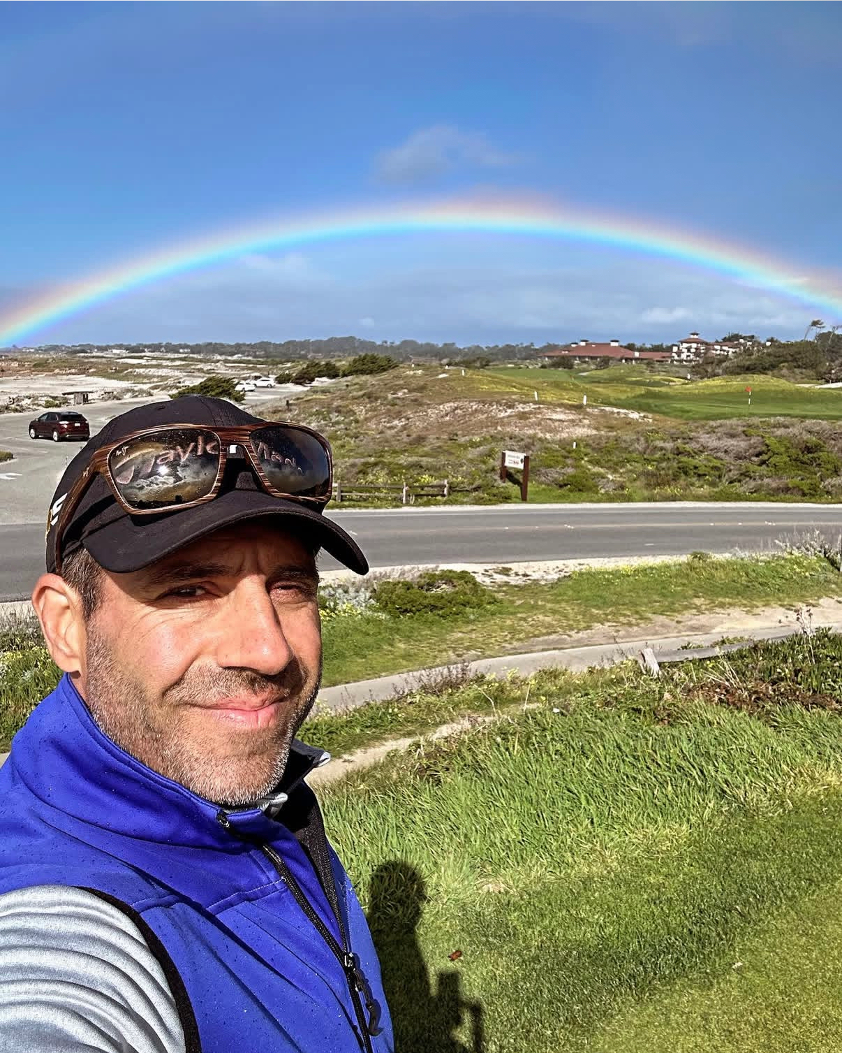 Alex Haigh with a dramatic rainbow over a coastal golf course