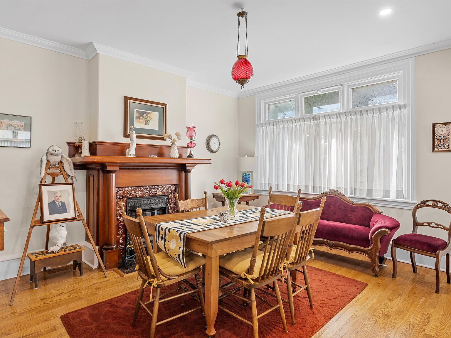 Dining room with original ornate fireplace mantel