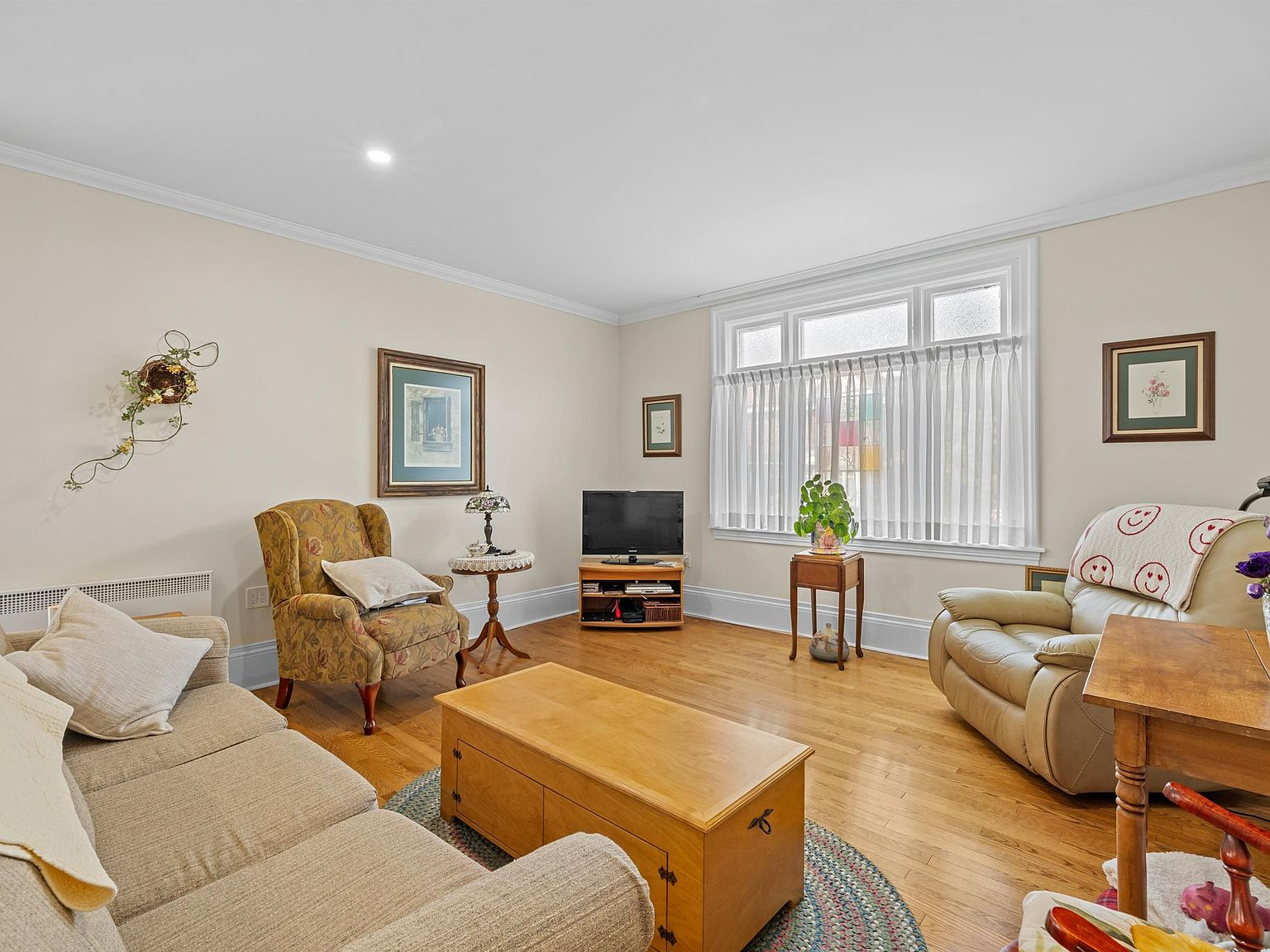 Refinished hardwood living room with soaring ceilings