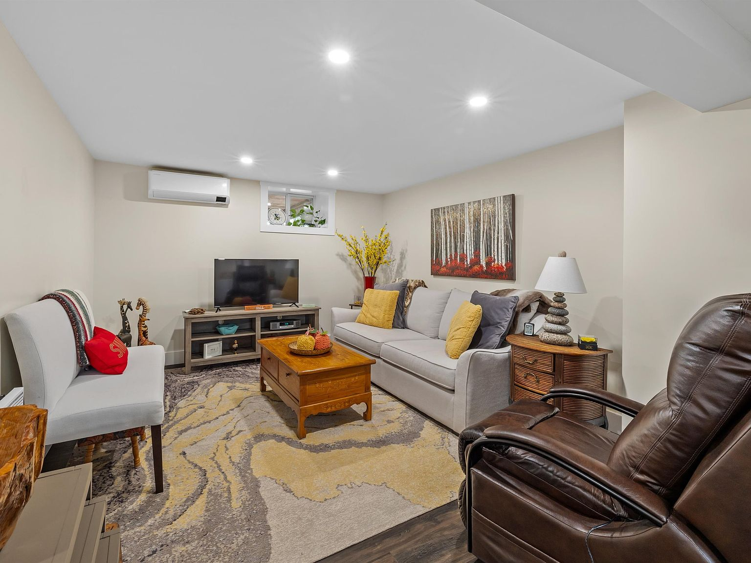 Modern neutral living room with heat pump and recessed lighting