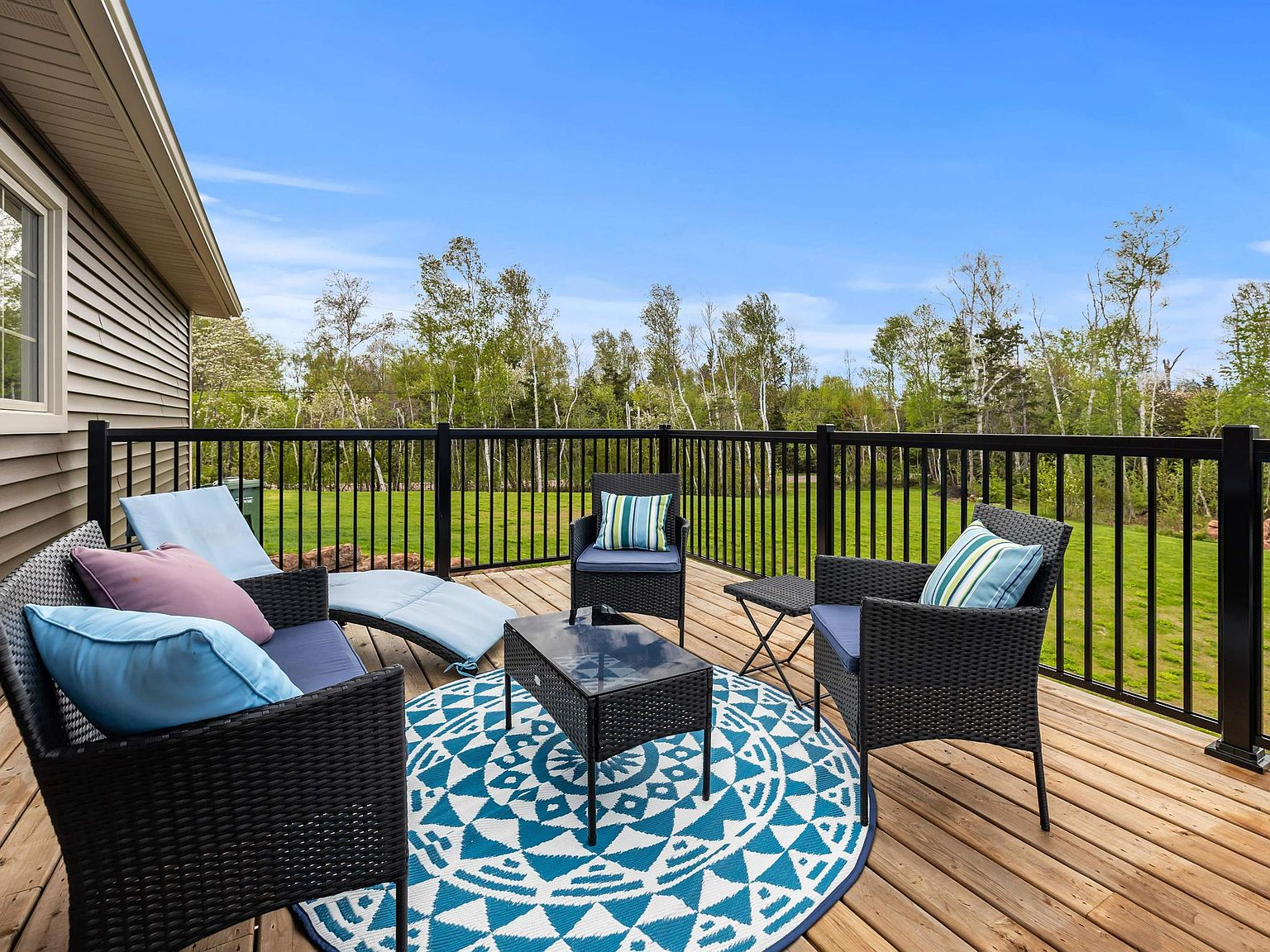 Upper deck overlooking wooded backyard