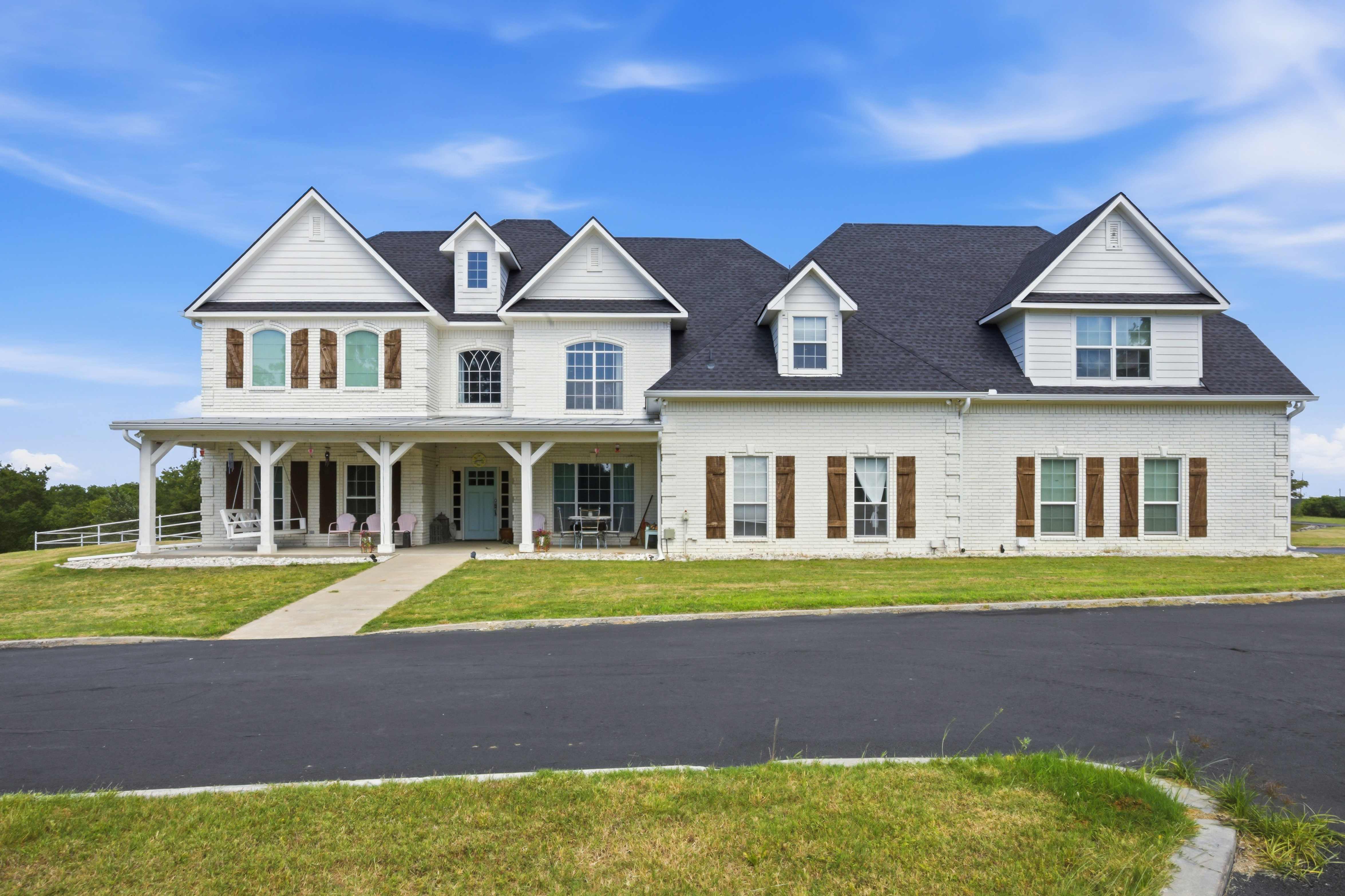 Head-on front view of the Modern Farmhouse with covered porch