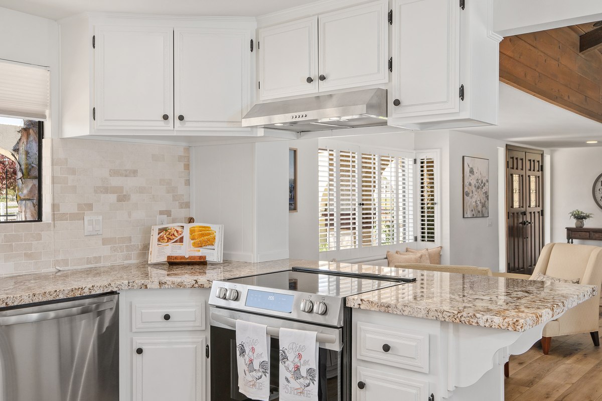 Kitchen with subway tile backsplash and stainless steel appliances