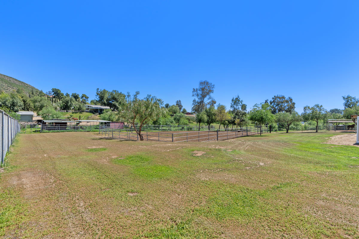 Equestrian riding arena with pipe corrals on the 3.26-acre property