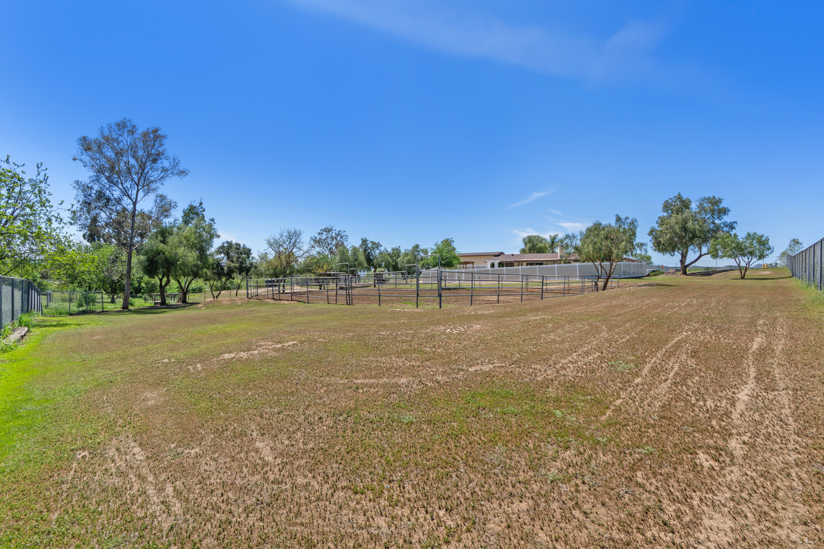 Wide view of pipe corral and riding arena