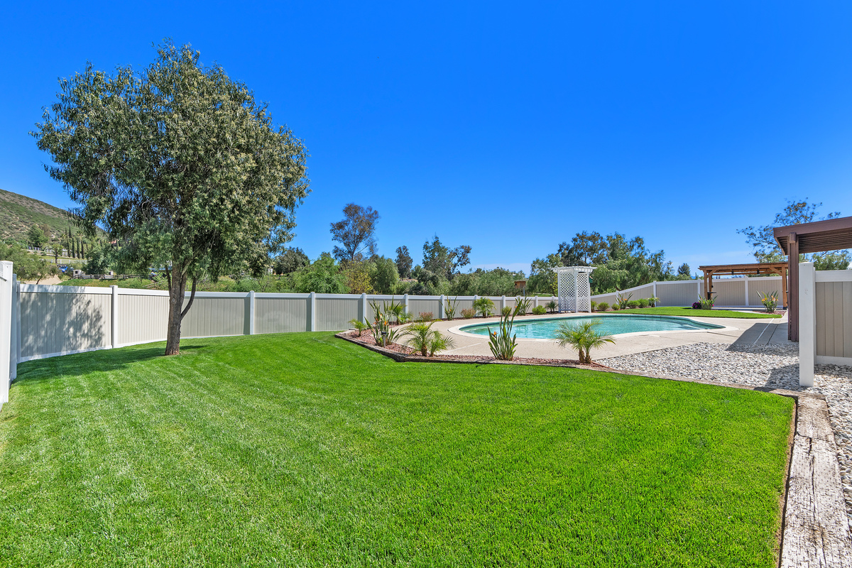 Pool and cabana with landscaping