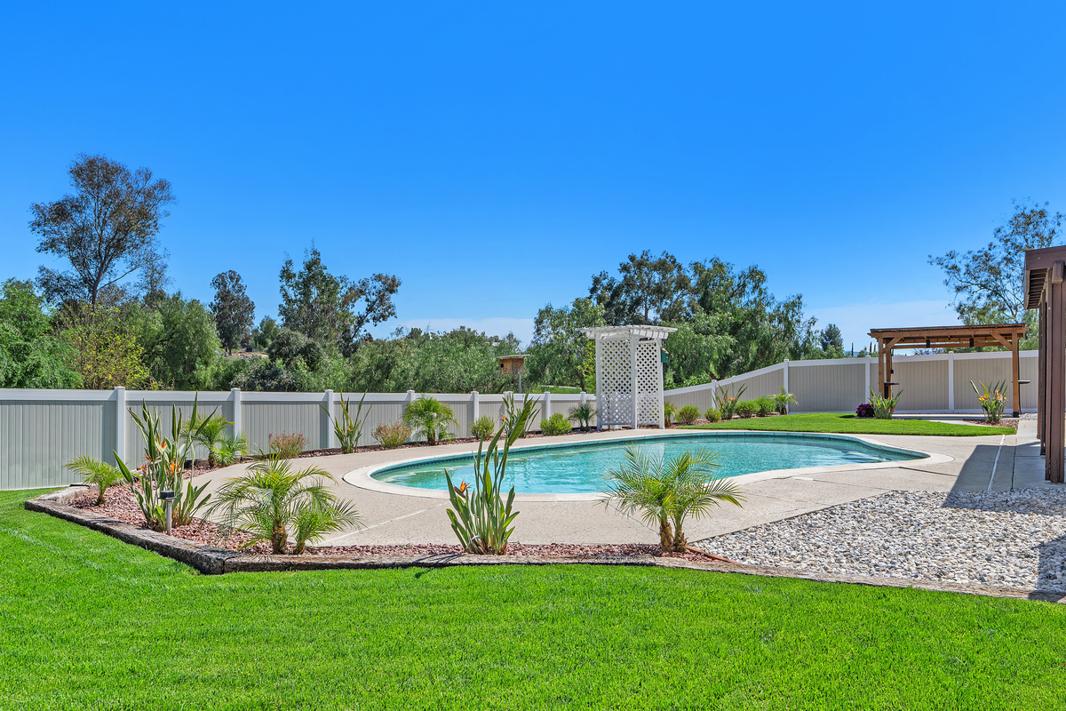 Pool area with pergola and rock beds