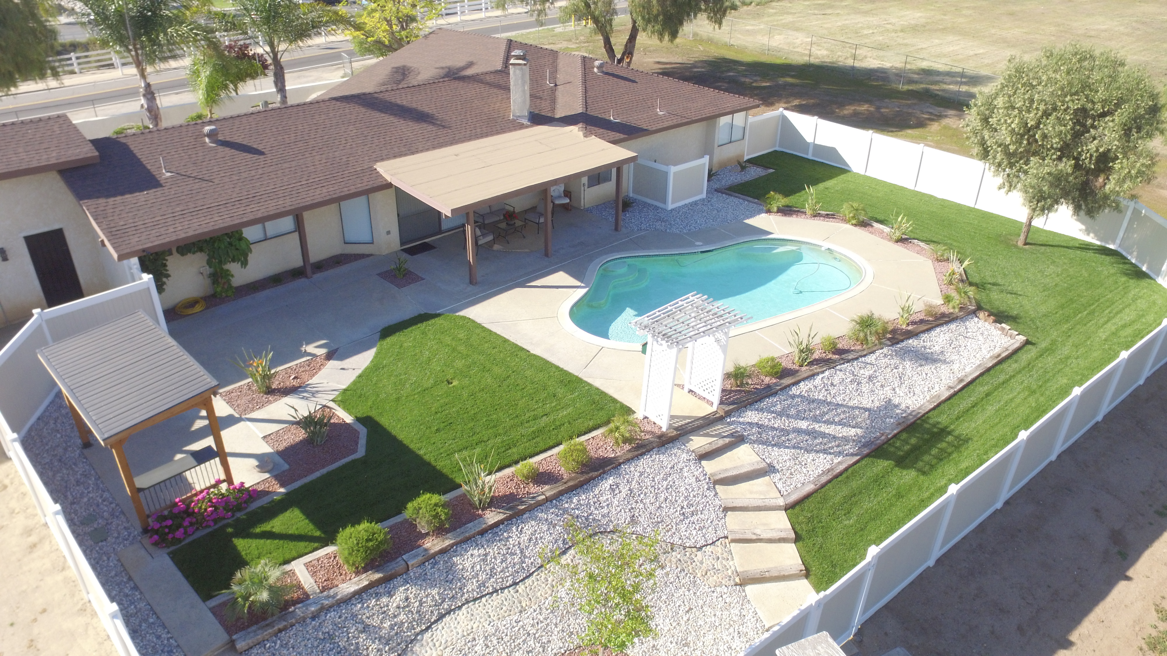 Drone aerial of pool area with patio