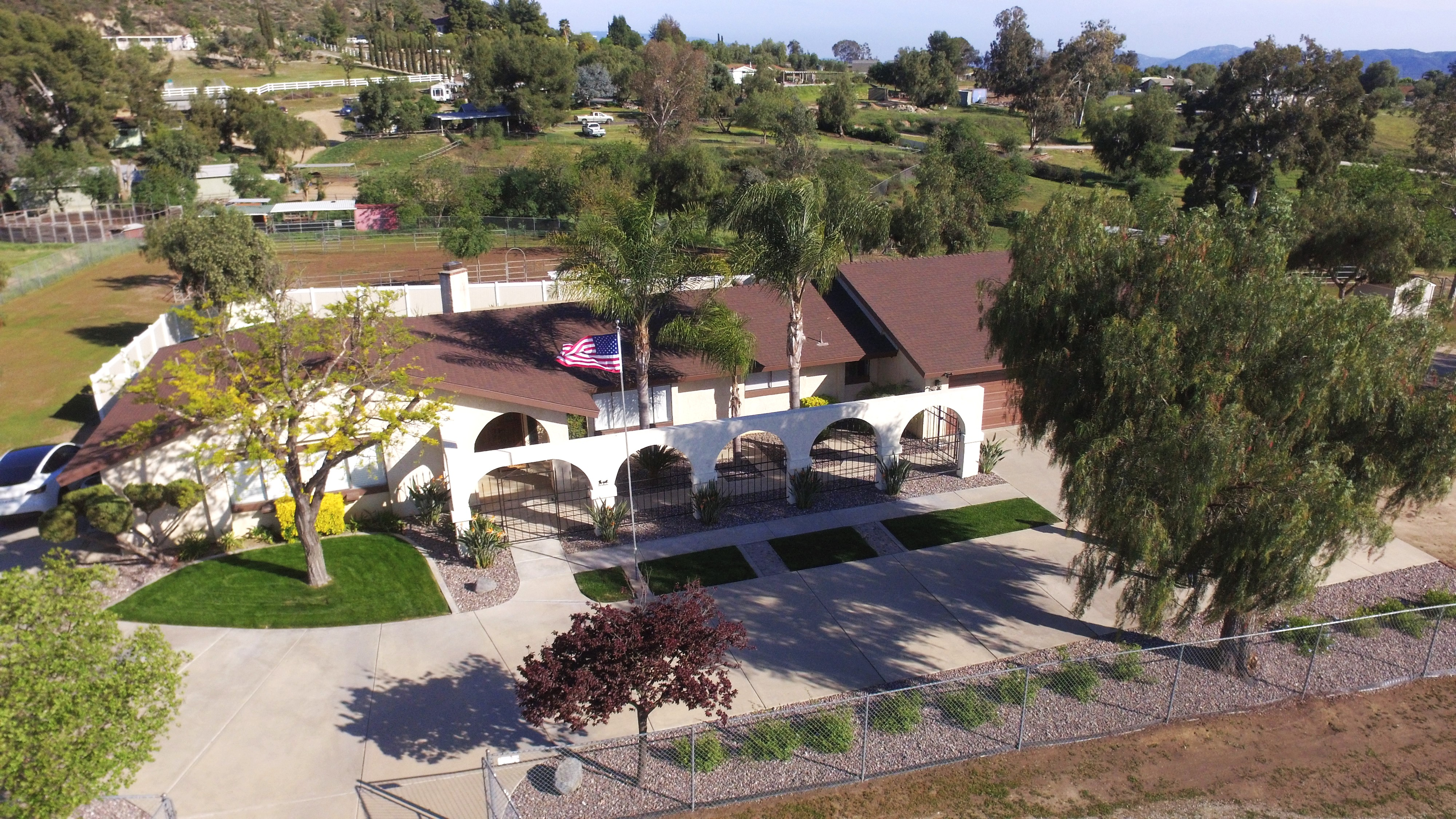 Aerial view of home facade and arched entryways